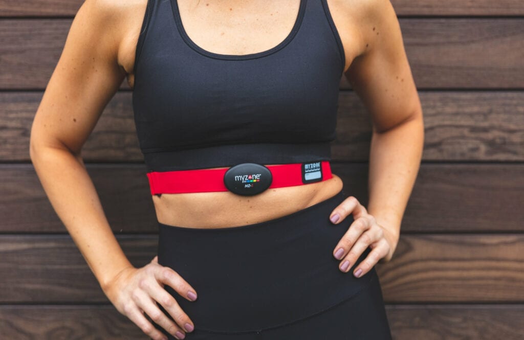 Close up on a MyZone heart rate monitor being worn by a woman